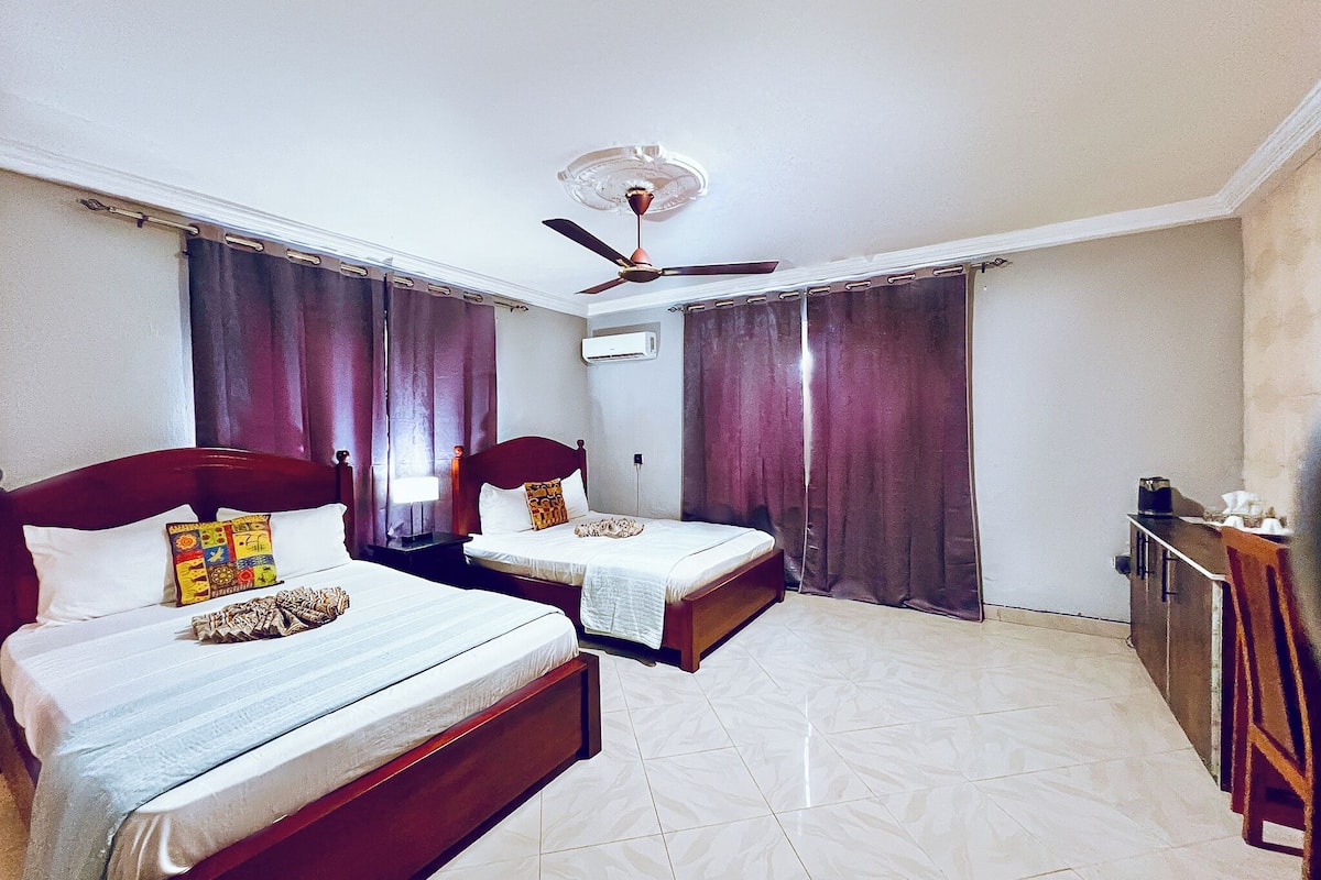 Premium bedding, desk, laptop workspace, blackout curtains