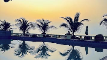 Outdoor pool, pool umbrellas, sun loungers