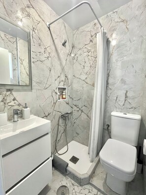 Shower, hair dryer, towels, soap