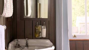 Bathtub, eco-friendly toiletries, towels