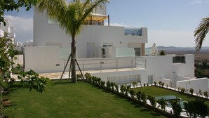 A modern white building with a flat roof, a balcony, and a small pool area. - MARINA 2 - Penthouse Sea-Views - Private terrace. Swimming Pool. Air Cond+Heat (Conil de la Frontera)