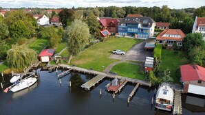 A residential area with houses, a dock, and a boat.