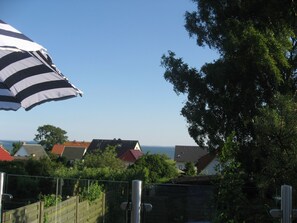 Enjoy a coastal retreat with a clear view of the sea and lush surroundings.