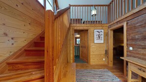 A wooden staircase leading to a second floor with a view of the outdoors. - Find rest - experience nature -Aussteigen on time (Stanz im Mürztal)
