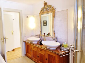 Bathtub, hair dryer, towels, soap