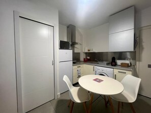 Fridge, microwave, stovetop, coffee/tea maker