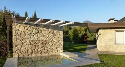 New villa with pool and large garden near the beach.