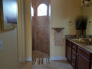 Combined shower/bathtub, hair dryer, towels, toilet paper