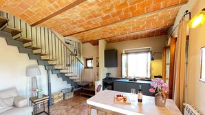 A modern kitchen with a central island, a built-in stove, and a window above the sink. - Fantastic apartment with terrace and pool overlooking Volterra (Volterra (PI))