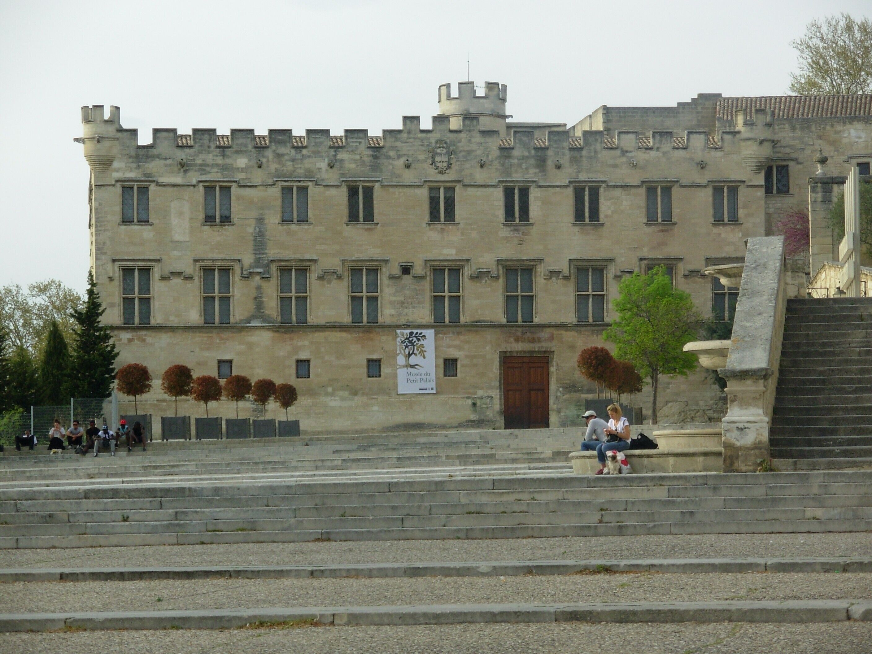 A historic building with a castle-like facade, featuring multiple windows and a prominent entrance.
