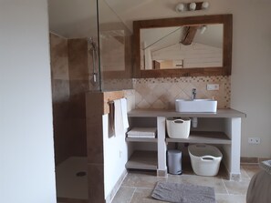 Shower, hair dryer, towels, toilet paper