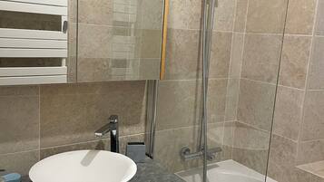 Bathtub, hair dryer, bidet