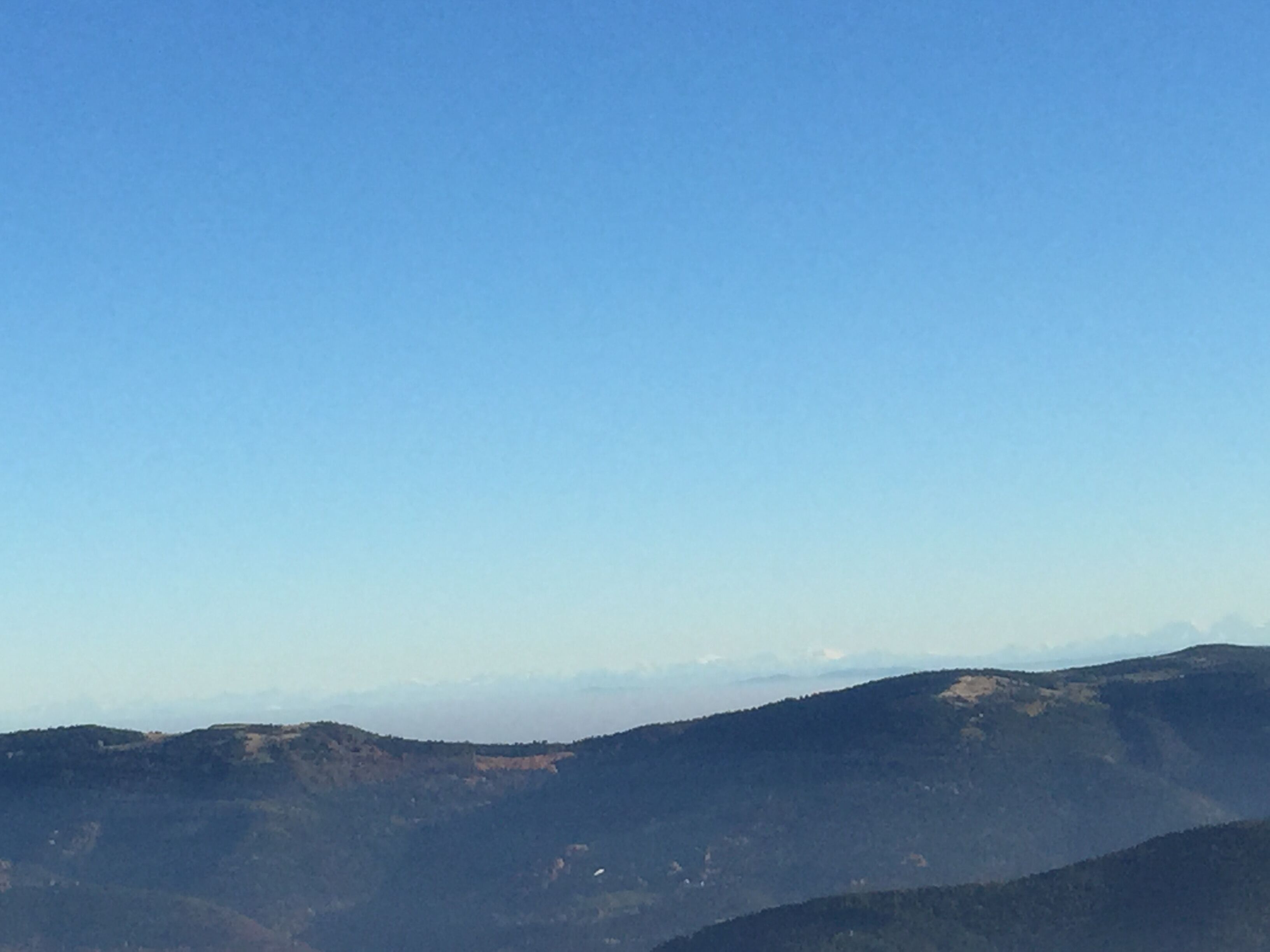 A mountainous landscape with clear skies.