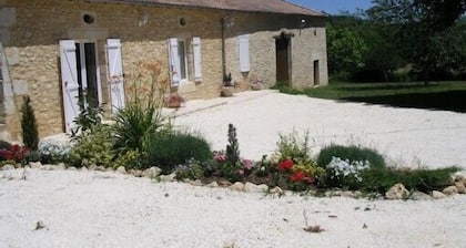 Pleasant stone house surrounded by woods and meadows