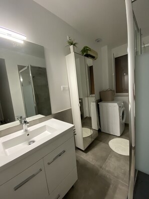 Shower, hair dryer, towels, soap
