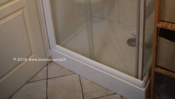 Shower, hair dryer, towels, toilet paper
