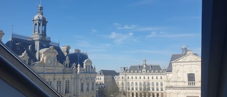 A historic building with classical architecture, including a prominent tower and detailed facade.