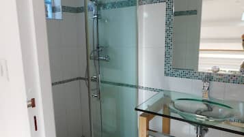 Shower, hair dryer, towels, toilet paper
