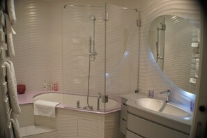 Bathtub, hair dryer, towels, soap