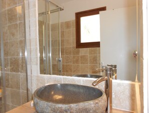 Bathtub, hair dryer, toilet paper
