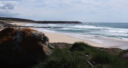 Breton house by the ocean in the dunes of Trez Goarem
