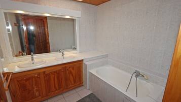 Bathtub, hair dryer, towels