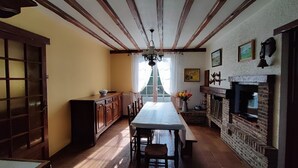 A spacious kitchen with a long table, wooden cabinets, and a brick fireplace. - SEASIDE VILLA / PETS ACCEPTED / WIFI / (Le Tréport)