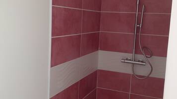 Shower, hair dryer, towels, toilet paper