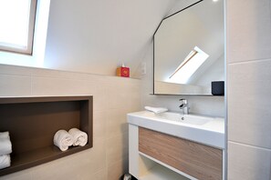 Shower, hair dryer, towels, toilet paper