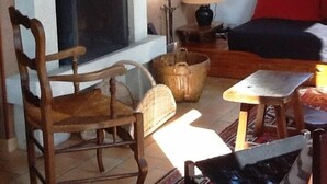 A cozy living room with a fireplace, a television, a sofa, and a coffee table. - Gérardmer, superb valley view, Gite ****, Internet, TV, Short Stay adm (Rochesson)