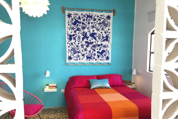 Front room with queen size bed with firm pillow top mattress.