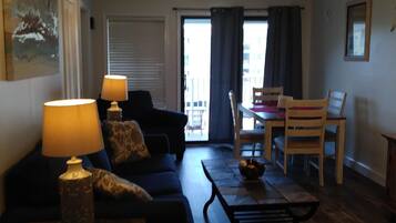 Flat-screen TV, DVD player, books, video library