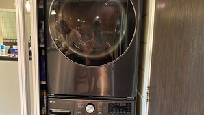 A stainless steel LG ThinQ washer and dryer unit with a control panel, a digital display, and a water level indicator. - 2 bdrm 2 Bath Condo with Partial Ocean Views, Steps away from Kamaole III Beach  (Kihei)