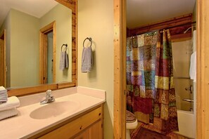 Bathtub, hair dryer, towels, soap