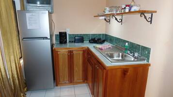 Fridge, microwave, stovetop, coffee/tea maker