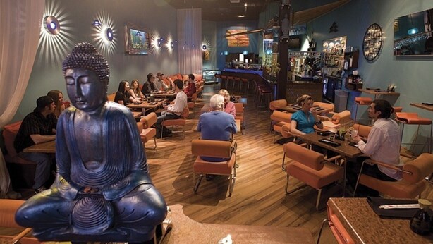A restaurant with a Buddha statue centerpiece, wooden flooring, and a bar area. - 5 Minutes From The Lake! Million Dollar Views! (Page)