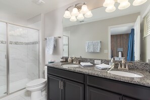 Combined shower/tub, hair dryer, towels, soap