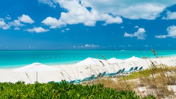 On the beach, sun-loungers, beach towels