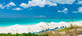 A few steps from the door and you're on Grace Bay Beach!