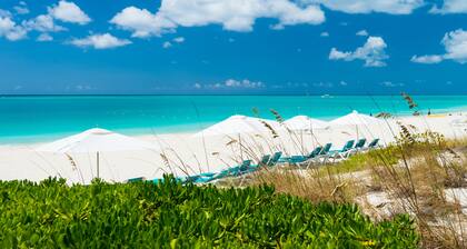 A few steps from the door and you're on Grace Bay Beach!