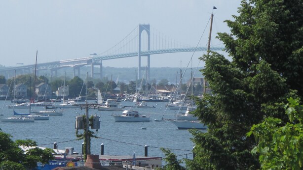 A marina with boats and a bridge in the background. - Your search ends here! (Newport)