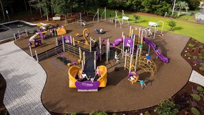 A playground with various play structures including slides and climbing areas. - 4 Bedroom, 2.5 Bath,  sleeps 8,  Ocean View, Large Family Room and Sunroom (Emerald Isle)