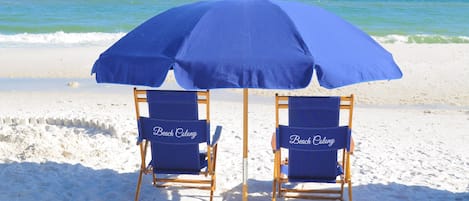 On the beach, sun-loungers