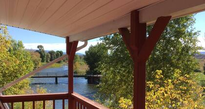 A big red barn on the river