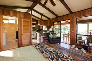 Relax in this inviting space with a large bed, sofa, and kitchen area.