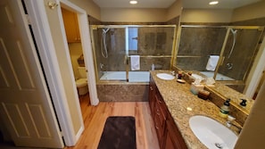 Combined shower/tub, hair dryer, towels, soap