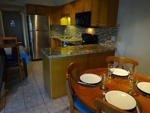 Dining room & updated kitchen-granite + glass and marble back splash 