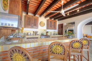 Enjoy cooking in this well-equipped kitchen with a large island and ample counter space.