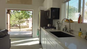 Fridge, microwave, stovetop, coffee/tea maker