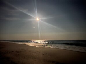 On the beach, sun-loungers